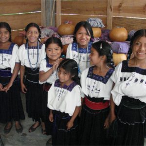 Zapatista students in front of squash containers holding GMO-free corn tortillas in Chiapas, Mexico