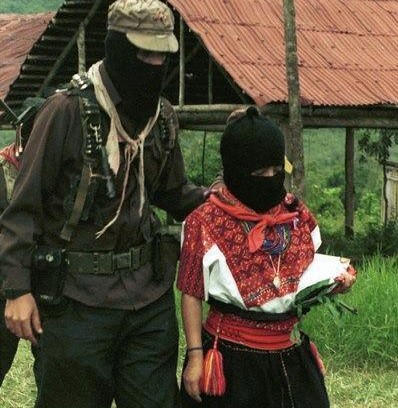 Marcos walks with Ramona to the helicopter which will fly her to Mexico City from the Zapatista community of La Realidad, Chiapas, Mexico.