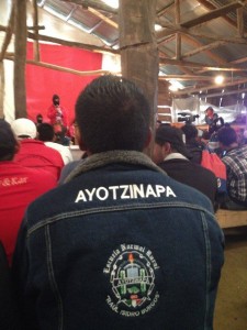 Visiting family members of the 43 disappeared from Ayotzinapa listens to a Zapatista woman in the auditorium at Oventic, Chiapas, Mexico.