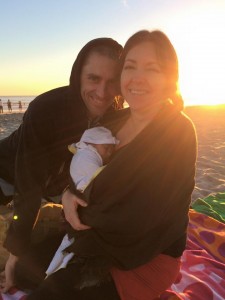 Adriana and Rich with Kai on his first trip to the beach.